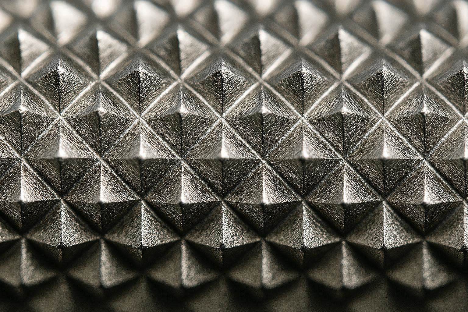 Macro close-up of diamond knurl pattern on 304 stainless steel grab bar